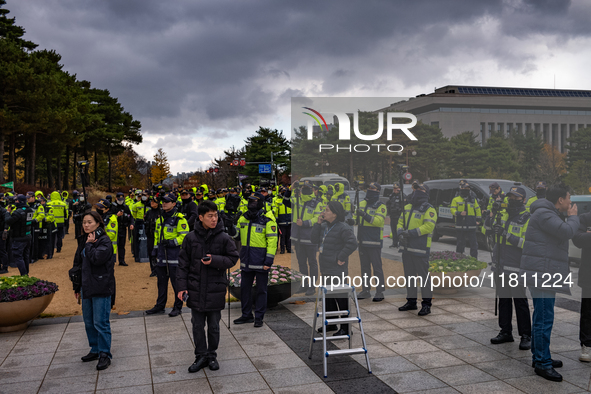 Over 100 members of the Cargo Truckers' Solidarity Division under the Korean Confederation of Trade Unions Public Transport Workers' Union s...