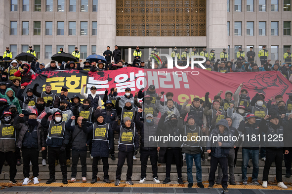 Over 100 members of the Cargo Truckers' Solidarity Division under the Korean Confederation of Trade Unions Public Transport Workers' Union s...