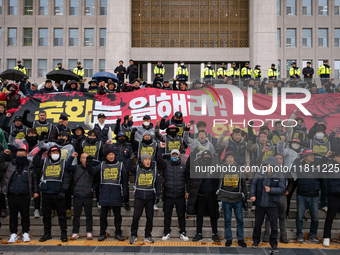 Over 100 members of the Cargo Truckers' Solidarity Division under the Korean Confederation of Trade Unions Public Transport Workers' Union s...