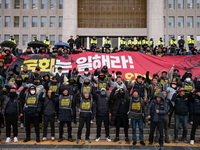 Over 100 members of the Cargo Truckers' Solidarity Division under the Korean Confederation of Trade Unions Public Transport Workers' Union s...