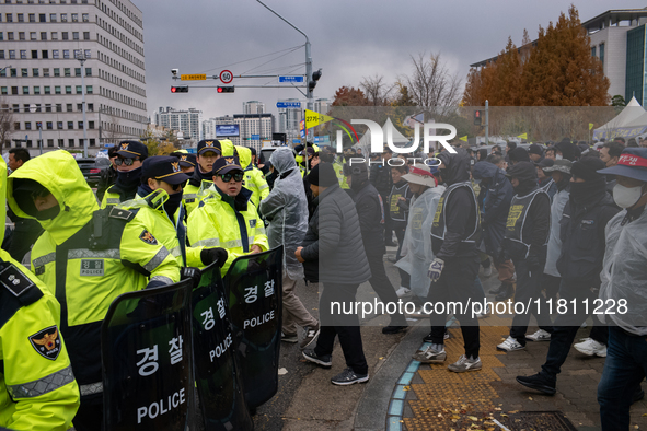 Over 100 members of the Cargo Truckers' Solidarity Division under the Korean Confederation of Trade Unions Public Transport Workers' Union s...