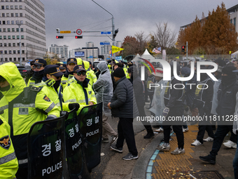 Over 100 members of the Cargo Truckers' Solidarity Division under the Korean Confederation of Trade Unions Public Transport Workers' Union s...