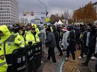 Over 100 members of the Cargo Truckers' Solidarity Division under the Korean Confederation of Trade Unions Public Transport Workers' Union s...