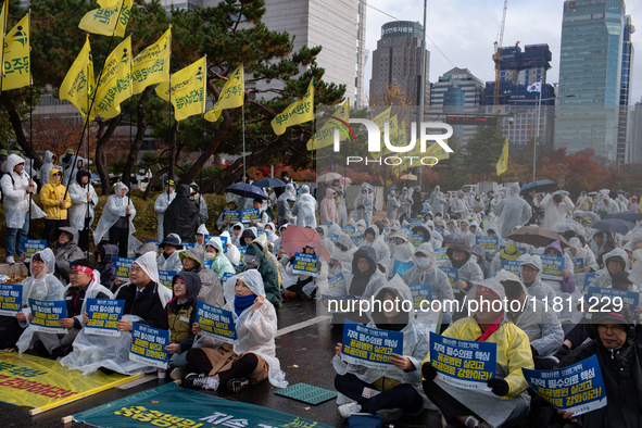 Hundreds of participants gather in front of the National Assembly in Yeouido, in Seoul, South Korea, on November 26, 2024, to demand increas...