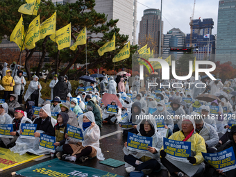 Hundreds of participants gather in front of the National Assembly in Yeouido, in Seoul, South Korea, on November 26, 2024, to demand increas...