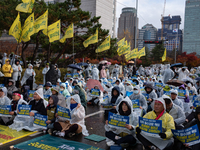 Hundreds of participants gather in front of the National Assembly in Yeouido, in Seoul, South Korea, on November 26, 2024, to demand increas...