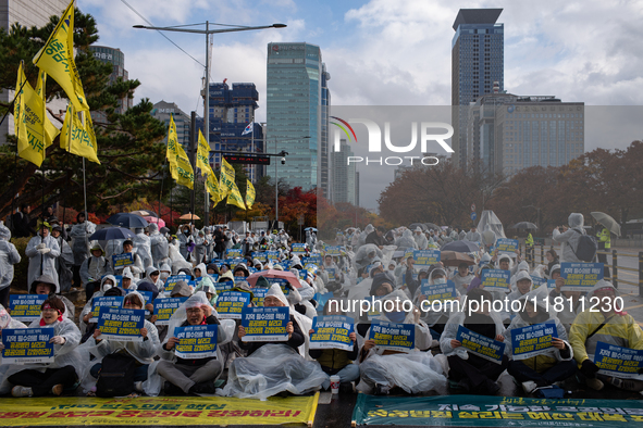 Hundreds of participants gather in front of the National Assembly in Yeouido, in Seoul, South Korea, on November 26, 2024, to demand increas...