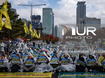 Hundreds of participants gather in front of the National Assembly in Yeouido, in Seoul, South Korea, on November 26, 2024, to demand increas...