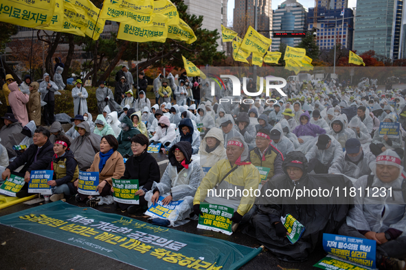 Hundreds of participants gather in front of the National Assembly in Yeouido, in Seoul, South Korea, on November 26, 2024, to demand increas...