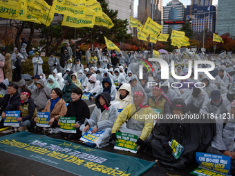 Hundreds of participants gather in front of the National Assembly in Yeouido, in Seoul, South Korea, on November 26, 2024, to demand increas...