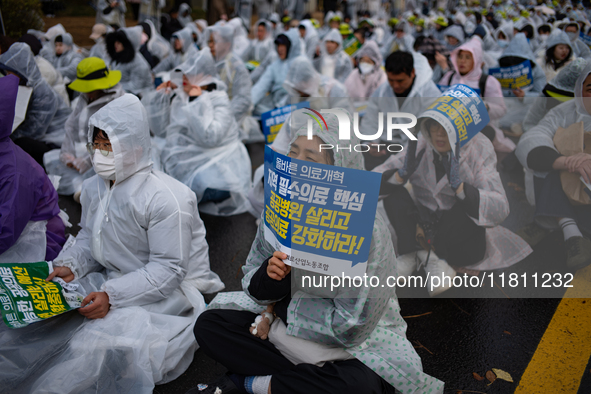 Hundreds of participants gather in front of the National Assembly in Yeouido, in Seoul, South Korea, on November 26, 2024, to demand increas...