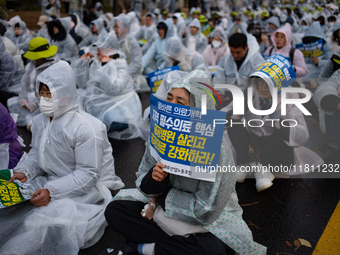 Hundreds of participants gather in front of the National Assembly in Yeouido, in Seoul, South Korea, on November 26, 2024, to demand increas...