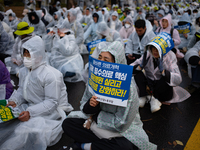 Hundreds of participants gather in front of the National Assembly in Yeouido, in Seoul, South Korea, on November 26, 2024, to demand increas...