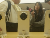 Customers experience the newly released Mate70 series mobile phone at a Huawei store in Hangzhou, Zhejiang province, China, on November 26,...