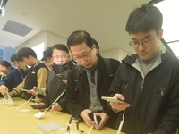 Customers experience the newly released Mate70 series mobile phone at a Huawei store in Hangzhou, Zhejiang province, China, on November 26,...