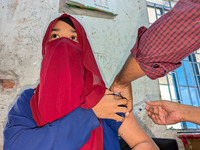 A madrasah student receives the HPV vaccine from a healthcare assistant in Feni, Bangladesh, on November 26, 2024. Bangladesh takes strides...