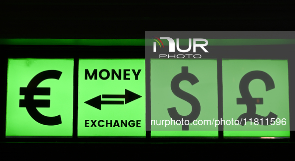 KRAKOW, POLAND - NOVEMBER 21:   
A sign with Euro, Dollar, and Pound symbols outside a currency exchange office in Krakow's Old Town, on Nov...