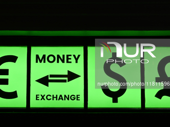 KRAKOW, POLAND - NOVEMBER 21:   
A sign with Euro, Dollar, and Pound symbols outside a currency exchange office in Krakow's Old Town, on Nov...