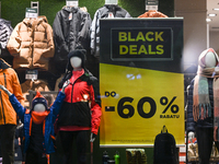 KRAKOW, POLAND - NOVEMBER 21:   
A 'Black Deal Up to 60%' poster displayed in the window of The Mountain Warehouse store, on November 21, 20...