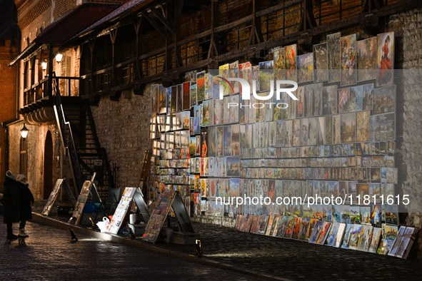 KRAKOW, POLAND - NOVEMBER 21:   
An open-air art gallery near Florianska Gate in Krakow's Old Town, showcasing paintings by local artists di...