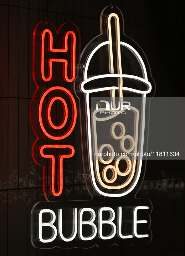 KRAKOW, POLAND - NOVEMBER 21:   
A 'Hot Bubble' neon sign at the entrance of a store, on November 21, 2024 in Krakow, Poland. 