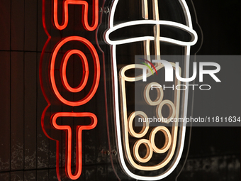 KRAKOW, POLAND - NOVEMBER 21:   
A 'Hot Bubble' neon sign at the entrance of a store, on November 21, 2024 in Krakow, Poland. (