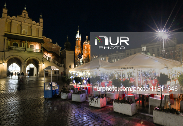 KRAKOW, POLAND - NOVEMBER 21:   
General view of outdoor seating at restaurants in Krakow's Main Market Square, decorated for the Christmas...