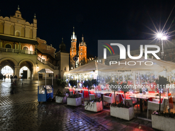 KRAKOW, POLAND - NOVEMBER 21:   
General view of outdoor seating at restaurants in Krakow's Main Market Square, decorated for the Christmas...