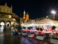 KRAKOW, POLAND - NOVEMBER 21:   
General view of outdoor seating at restaurants in Krakow's Main Market Square, decorated for the Christmas...