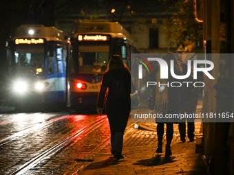 KRAKOW, POLAND - NOVEMBER 21:   
A winter evening view of crossing tramways near Krakow's Old Town, illuminated by streetlights, on November...