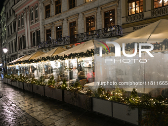 KRAKOW, POLAND - NOVEMBER 21:   
General view of outdoor seating at restaurants in Krakow's Main Market Square, decorated for the Christmas...