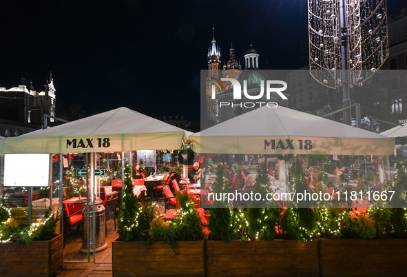 KRAKOW, POLAND - NOVEMBER 21:   
General view of outdoor seating at restaurants in Krakow's Main Market Square, decorated for the Christmas...