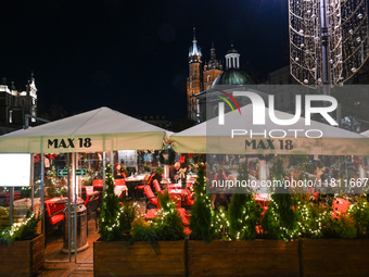 KRAKOW, POLAND - NOVEMBER 21:   
General view of outdoor seating at restaurants in Krakow's Main Market Square, decorated for the Christmas...