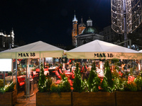 KRAKOW, POLAND - NOVEMBER 21:   
General view of outdoor seating at restaurants in Krakow's Main Market Square, decorated for the Christmas...