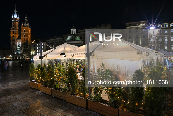 KRAKOW, POLAND - NOVEMBER 21:   
General view of outdoor seating at restaurants in Krakow's Main Market Square, decorated for the Christmas...