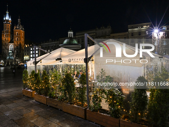 KRAKOW, POLAND - NOVEMBER 21:   
General view of outdoor seating at restaurants in Krakow's Main Market Square, decorated for the Christmas...