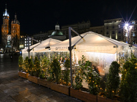 KRAKOW, POLAND - NOVEMBER 21:   
General view of outdoor seating at restaurants in Krakow's Main Market Square, decorated for the Christmas...