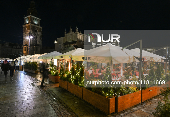 KRAKOW, POLAND - NOVEMBER 21:   
General view of outdoor seating at restaurants in Krakow's Main Market Square, decorated for the Christmas...