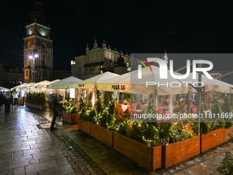 KRAKOW, POLAND - NOVEMBER 21:   
General view of outdoor seating at restaurants in Krakow's Main Market Square, decorated for the Christmas...