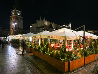 KRAKOW, POLAND - NOVEMBER 21:   
General view of outdoor seating at restaurants in Krakow's Main Market Square, decorated for the Christmas...