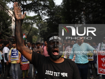 Job seekers and teachers shout slogans demanding the requirement for fifty thousand vacant posts as they take part in a protest march in Kol...