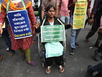 Job seekers and teachers shout slogans demanding the requirement for fifty thousand vacant posts as they take part in a protest march in Kol...