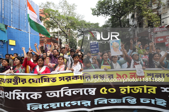 Job seekers and teachers shout slogans demanding the requirement for fifty thousand vacant posts as they take part in a protest march in Kol...