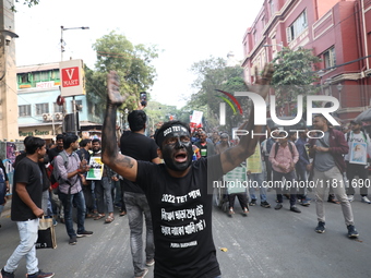 Job seekers and teachers shout slogans demanding the requirement for fifty thousand vacant posts as they take part in a protest march in Kol...