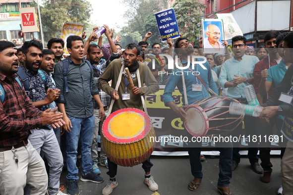 Job seekers and teachers shout slogans demanding the requirement for fifty thousand vacant posts as they take part in a protest march in Kol...