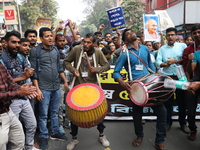 Job seekers and teachers shout slogans demanding the requirement for fifty thousand vacant posts as they take part in a protest march in Kol...