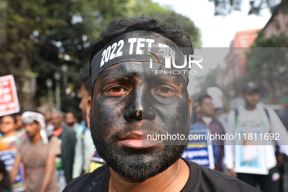 Job seekers and teachers shout slogans demanding the requirement for fifty thousand vacant posts as they take part in a protest march in Kol...