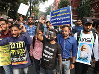 Job seekers and teachers shout slogans demanding the requirement for fifty thousand vacant posts as they take part in a protest march in Kol...