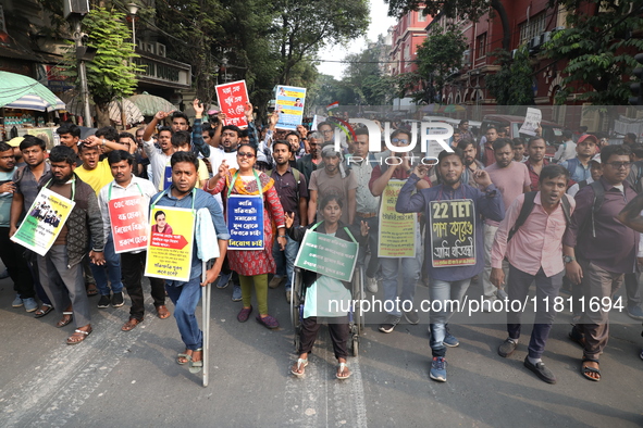 Job seekers and teachers shout slogans demanding the requirement for fifty thousand vacant posts as they take part in a protest march in Kol...