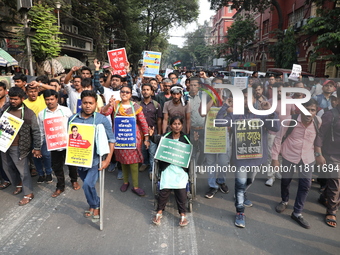 Job seekers and teachers shout slogans demanding the requirement for fifty thousand vacant posts as they take part in a protest march in Kol...